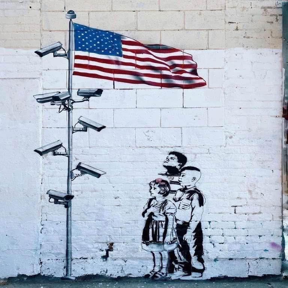 Banksy Meanwhile in America Big Brother is watching